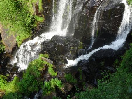 Free Stock Photo of Waterfall on black volcanic rocks