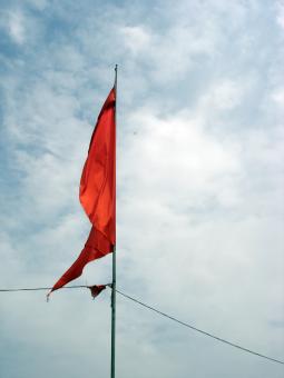 Free Stock Photo of Red flag on the sky