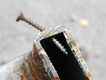 Free Stock Photo of Bent screw in metal