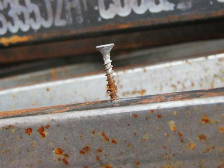 Free Stock Photo of Rusted screw in rusted metal