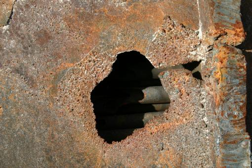 Free Stock Photo of Pipes inside a rusted tank