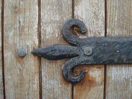 Free Stock Photo of Steel decoration on wooden door
