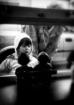 Free Stock Photo of Child looking at dolls