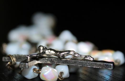 Free Stock Photo of Cross and String of Beads