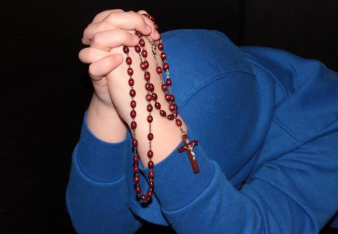 Free Stock Photo of Holding String of Beads - Praying