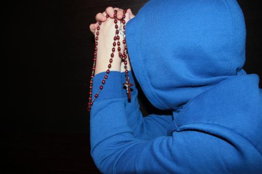 Free Stock Photo of Man in Blue Praying