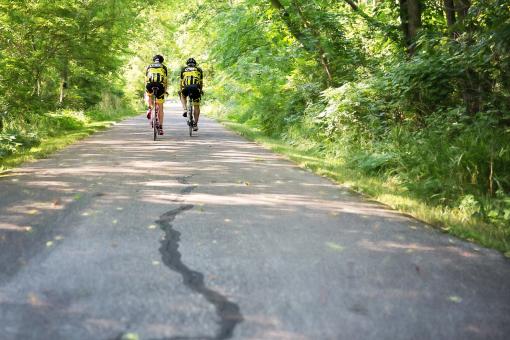 Free Stock Photo of Two Men on Bicycles
