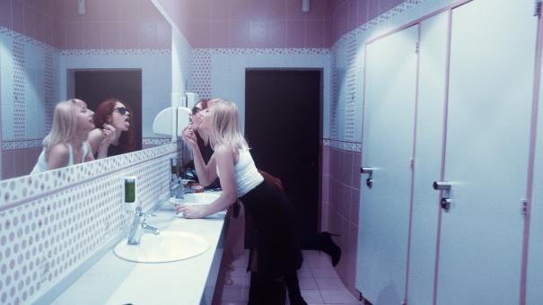 Free Stock Photo of Girlfriends Putting on Makeup
