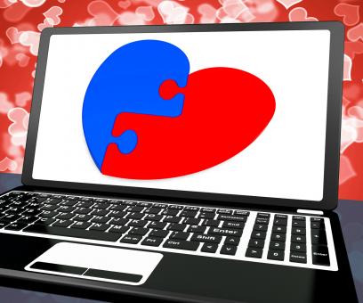 Free Stock Photo of Puzzle Heart On Laptop Shows Engagement