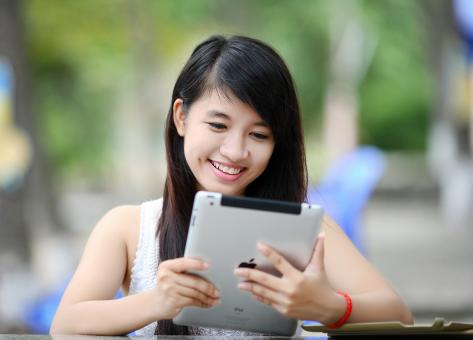 Free Stock Photo of Lady using IPad
