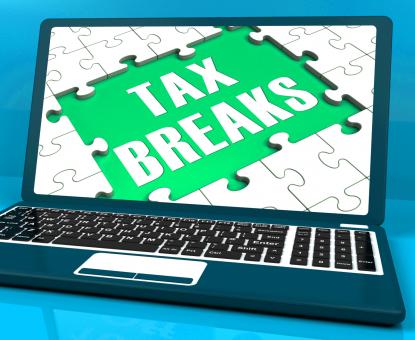 Free Stock Photo of Tax Breaks On Laptop Showing Internet Taxing