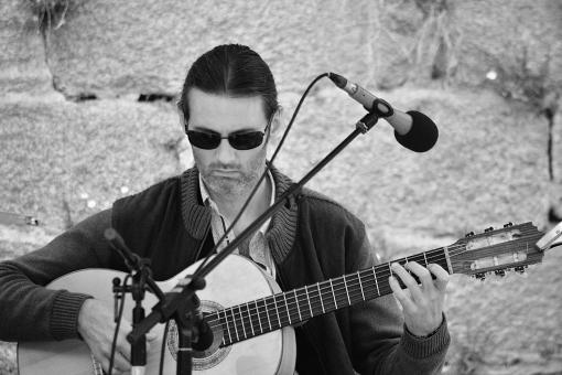 Free Stock Photo of Street Performer Playing Guitar