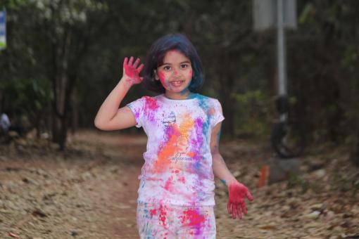 Free Stock Photo of Young Girl Covered in Colors