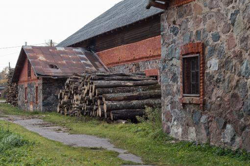 Free Stock Photo of A pile of wood next to warehouse