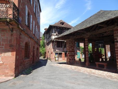 Free Stock Photo of Covered market and half-timbered medieval house in red village