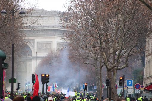 Free Stock Photo of Tear gas smoke under the Arc of Triumph