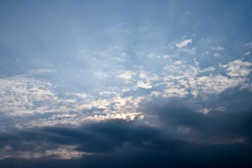 Free Stock Photo of Blue Sky with Sun Behind Clouds