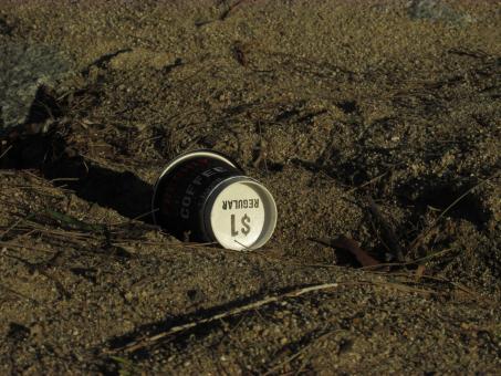 Free Stock Photo of Empty coffee cup on a beach