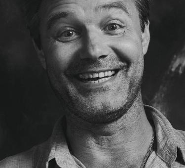 Free Stock Photo of Black and White Portrait of Happy Man