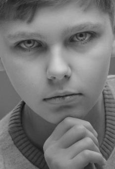 Free Stock Photo of Serious Young Boy - Black and White Portrait