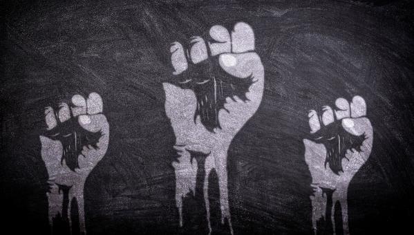 Free Stock Photo of Power to the People - Raised Fists on Blackboard