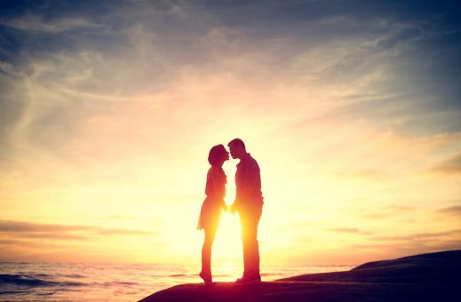 Free Stock Photo of Couple Kissing at Sunset on the Beach