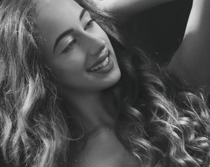 Free Stock Photo of Beautiful Girl with Long Curly Hair - Monochrome