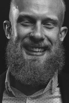 Free Stock Photo of Happy Bearded Male - Monochrome