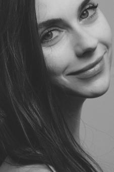 Free Stock Photo of Smiling Brunette - Monochrome Model Portrait