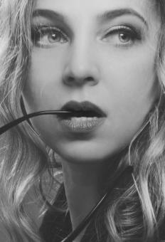 Free Stock Photo of Girl Biting on Sunglasses - Black and White