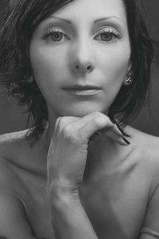 Free Stock Photo of Female Portrait - Hand under Chin - Monochrome