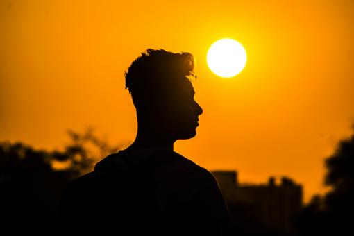 Free Stock Photo of Man Silhouette Against the Sun