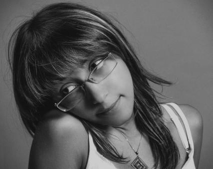 Free Stock Photo of Young Girl with Glasses - Monochrome Portrait