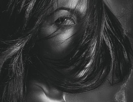 Free Stock Photo of Female Portrait - Dark Hair over Face - Monochrome