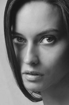 Free Stock Photo of Woman Looking into Camera - Black and White Portrait