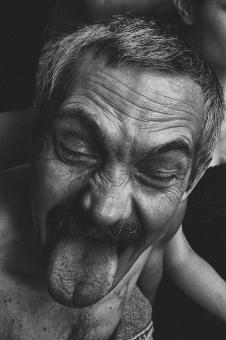 Free Stock Photo of Old Man Making Faces - Monochrome
