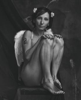 Free Stock Photo of Girl as Angel Sitting on Chair - Monochrome