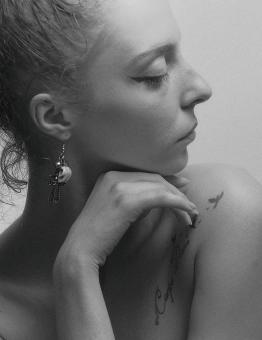Free Stock Photo of Profile of Girl with Earring and Tattoo