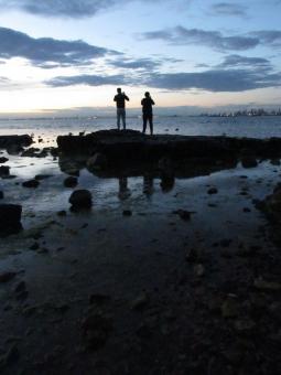 Free Stock Photo of Two people on top of a big rock in Brighton Beach