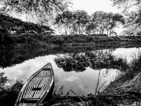 Free Stock Photo of A lonely boat in a quite canal 