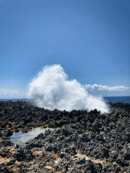 Free Stock Photo of Waves splashing against rocks formed by lava from a volcano on the isl