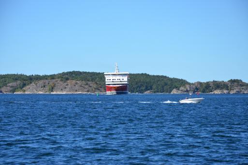 Free Stock Photo of A great ferry and a small boat is entering the harbour