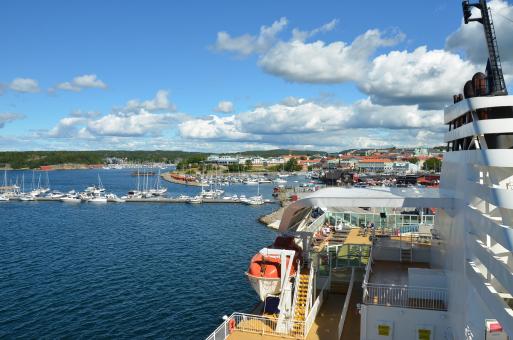 Free Stock Photo of A harbourview from a ferry, with a blue sky and clouds
