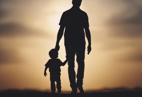 Free Stock Photo of Silhouette of Father Holding His Son's Hand