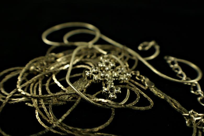 Free stock image of Cross lying on chains created by Bjorgvin
