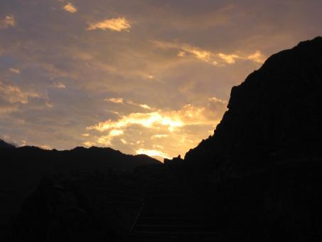 Sunset behind a mountain - Free Stock Photo