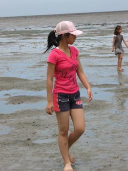 Girl Wading Through Mud - Free Stock Photo