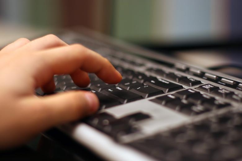Free stock image of Hand on keyboard created by Jakub Krechowicz