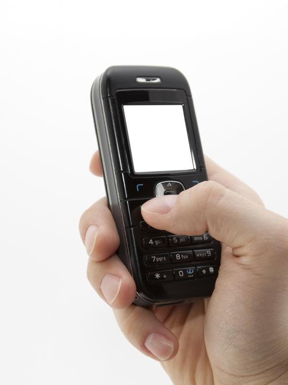 Free stock image of Mobile phone in hand  created by Jakub Krechowicz