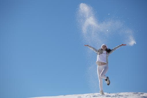 Young happy girl plays with snow - Free Stock Photo